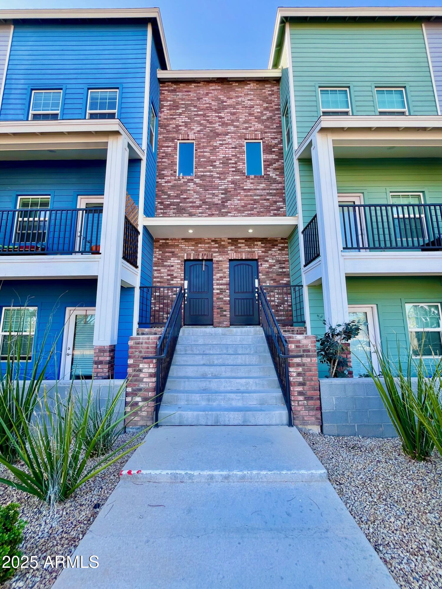 3434 North Longview Avenue, Unit 13 Phoenix, AZ 85014 - Photo 50 of 53 a front view of a house with entryway