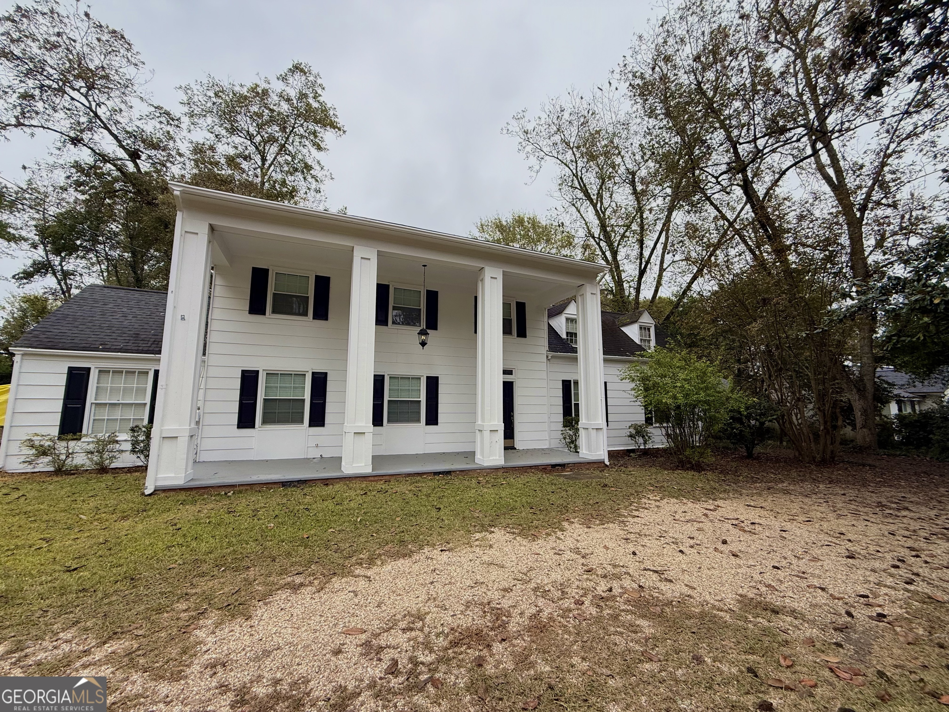 209 Mimosa Drive Dublin, GA 31021 - Photo 15 of 68 a front view of a house with a yard