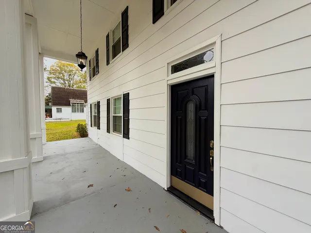 a view of entryway with wooden floor