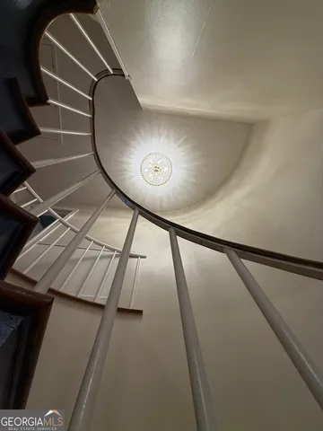 a view of a room with cabinets and wooden floor