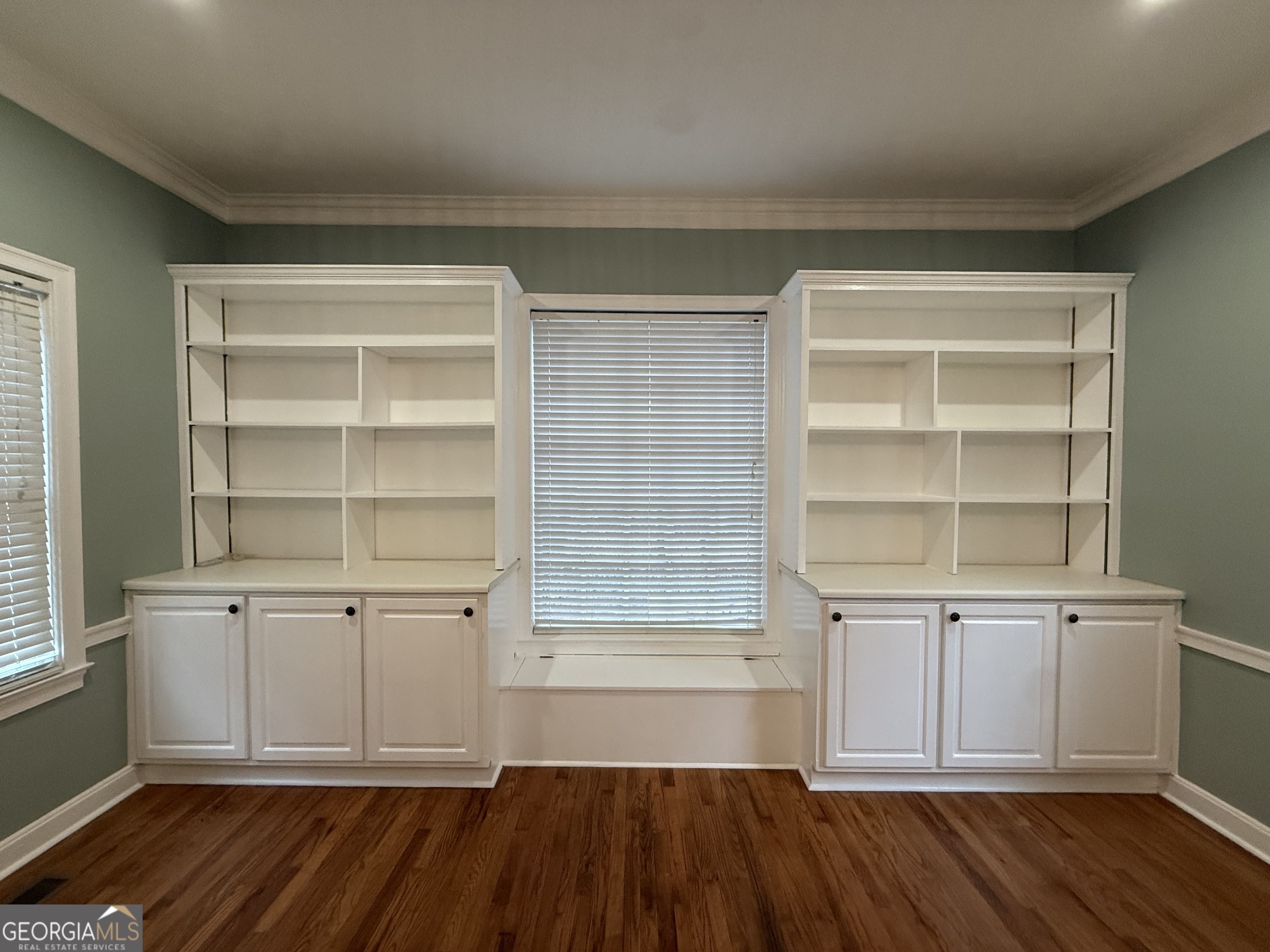 209 Mimosa Drive Dublin, GA 31021 - Photo 28 of 68 a view of a room with cabinets and wooden floor