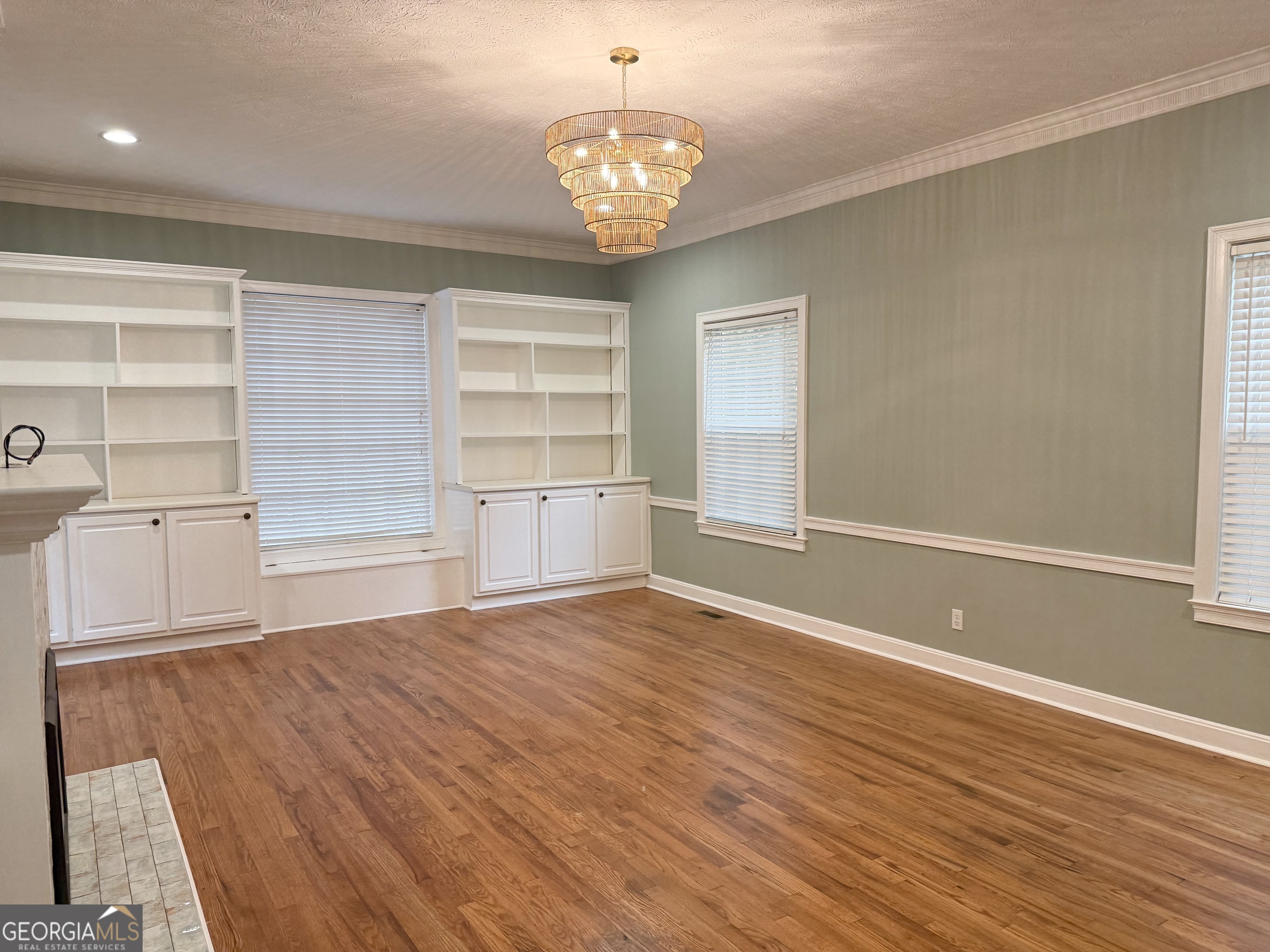 209 Mimosa Drive Dublin, GA 31021 - Photo 31 of 68 wooden floor in an empty room with a window