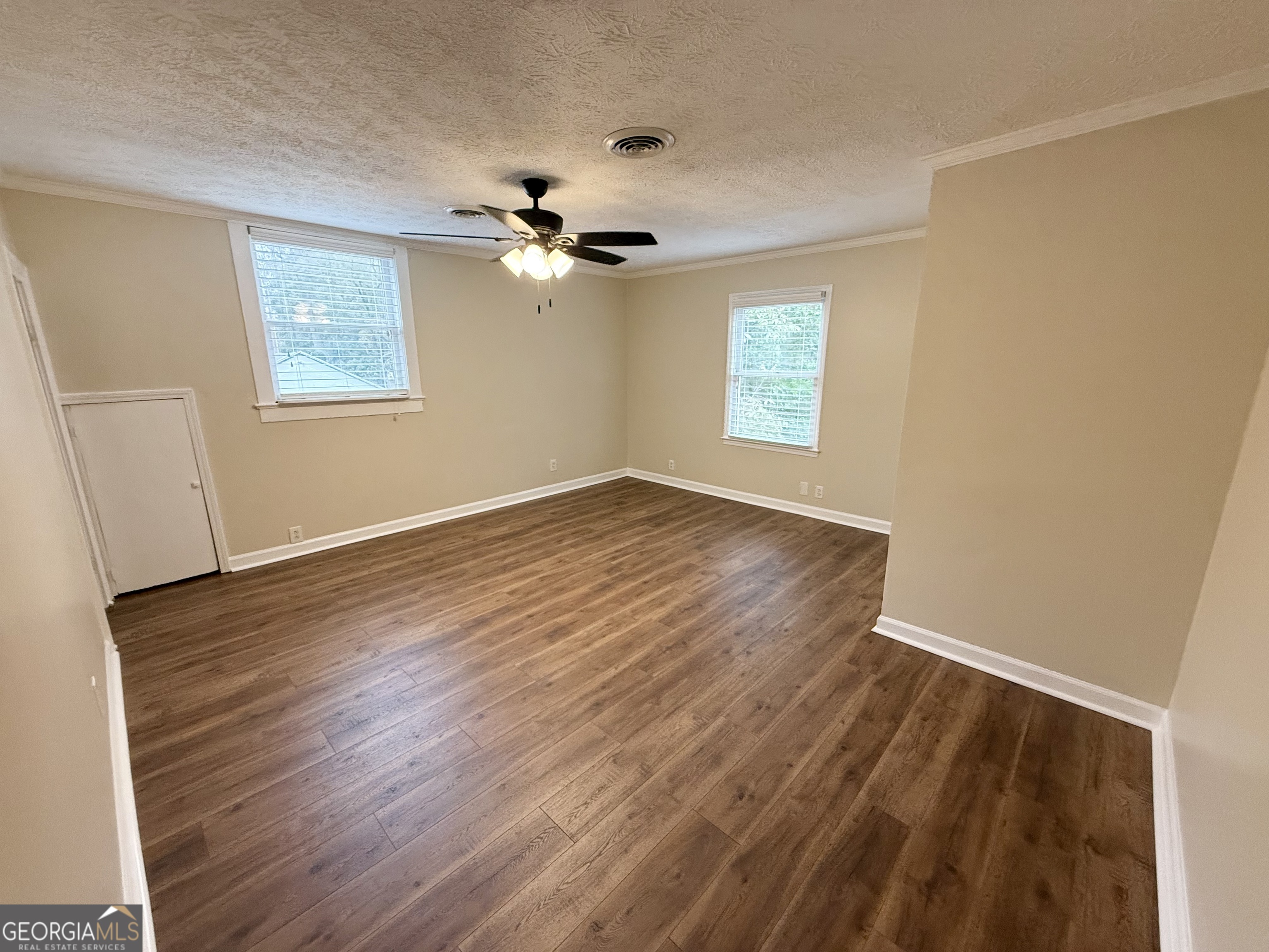 209 Mimosa Drive Dublin, GA 31021 - Photo 63 of 68 a view of empty room with wooden floor