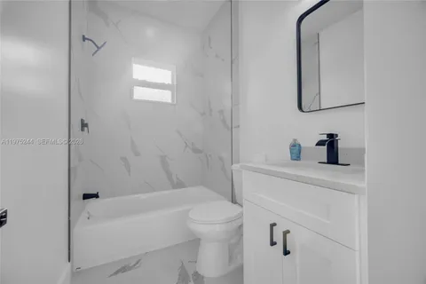 a bathroom with a sink a toilet and a bathtub