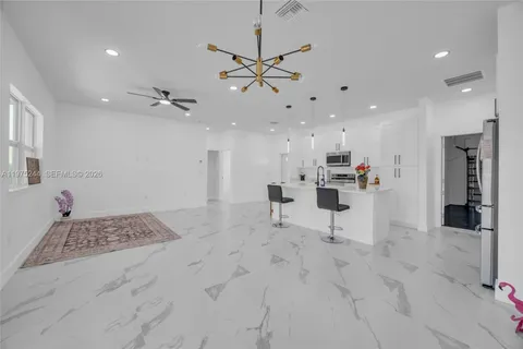 a view of kitchen with furniture and window