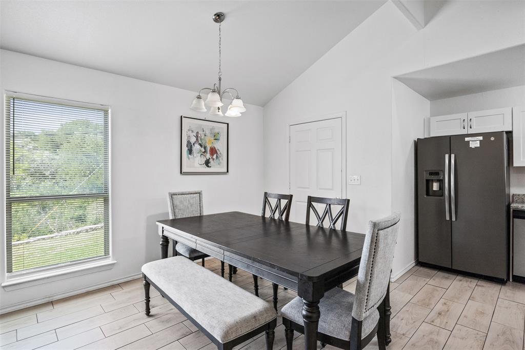1816 Hidden Valley Road Granbury, TX 76049 - Photo 11 of 23 a view of a dining room with furniture window and outside view