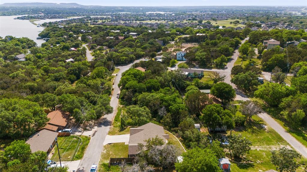 1816 Hidden Valley Road Granbury, TX 76049 - Photo 20 of 23 an aerial view of residential houses with outdoor space and trees