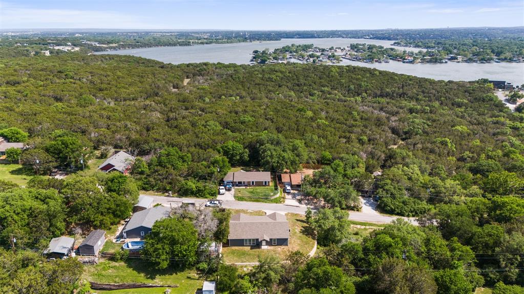 1816 Hidden Valley Road Granbury, TX 76049 - Photo 21 of 23 an aerial view of residential houses with outdoor space and trees