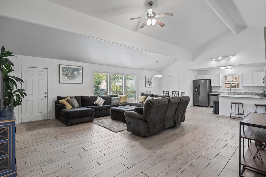 1816 Hidden Valley Road Granbury, TX 76049 - Photo 8 of 23 a living room with furniture and a chandelier