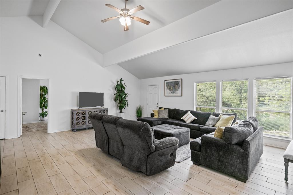 1816 Hidden Valley Road Granbury, TX 76049 - Photo 9 of 23 a living room with furniture and a large window