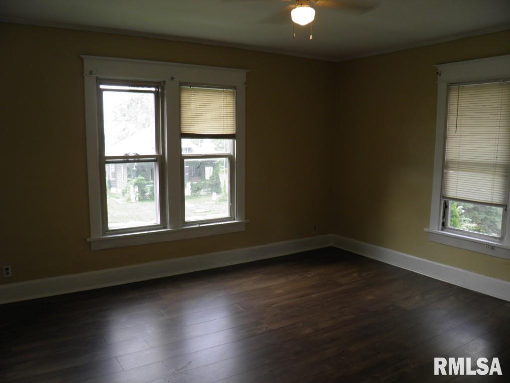 250 44th Street Moline, IL 61265 - Photo 14 of 19 an empty room with wooden floor and windows