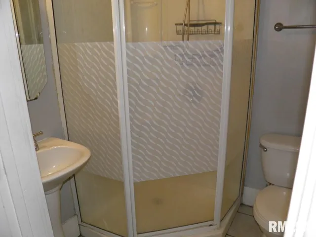 a bathroom with a sink and toilet