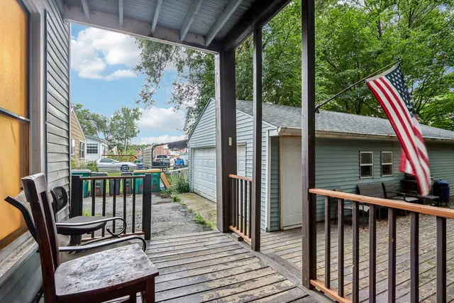 a view of a balcony with furniture