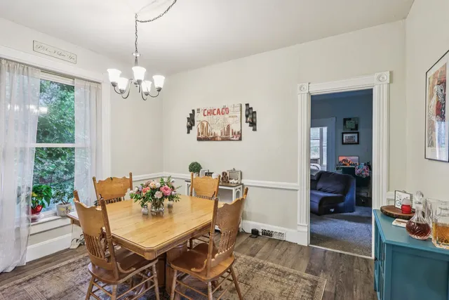 a dining room with furniture and window