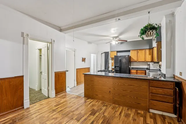a view of livingroom with furniture and chandelier fan