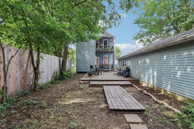 a front view of a house with sitting area