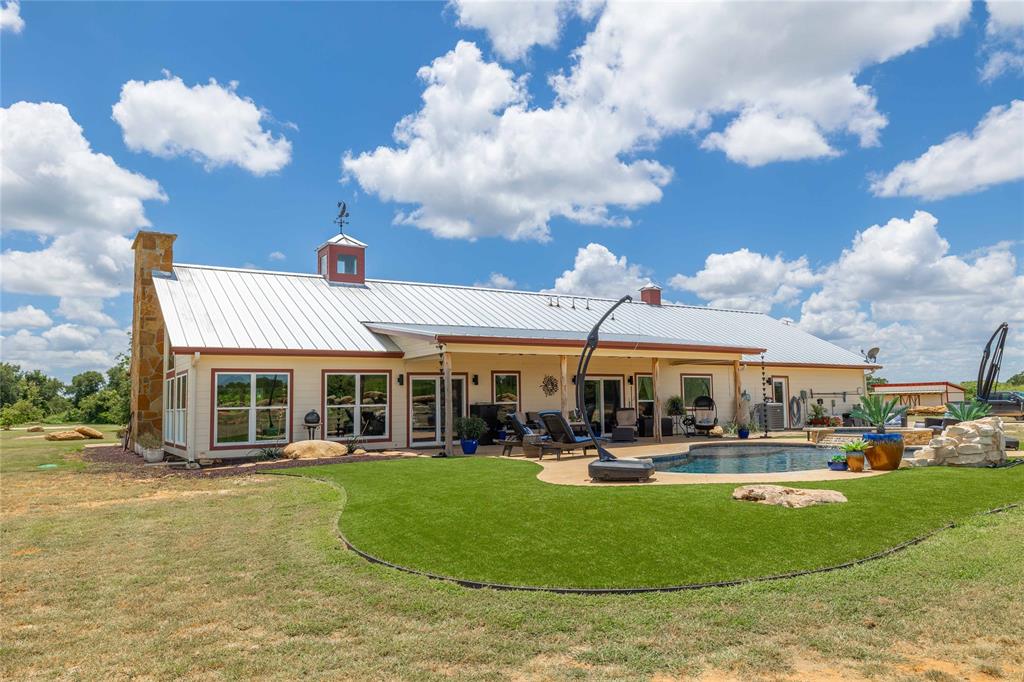 1010 Fm 583 Street West Rising Star, TX 76471 - Photo 9 of 40 a view of a building with a swimming pool
