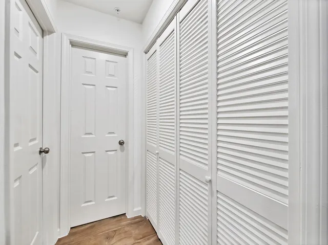 a view of a bathroom with a white door