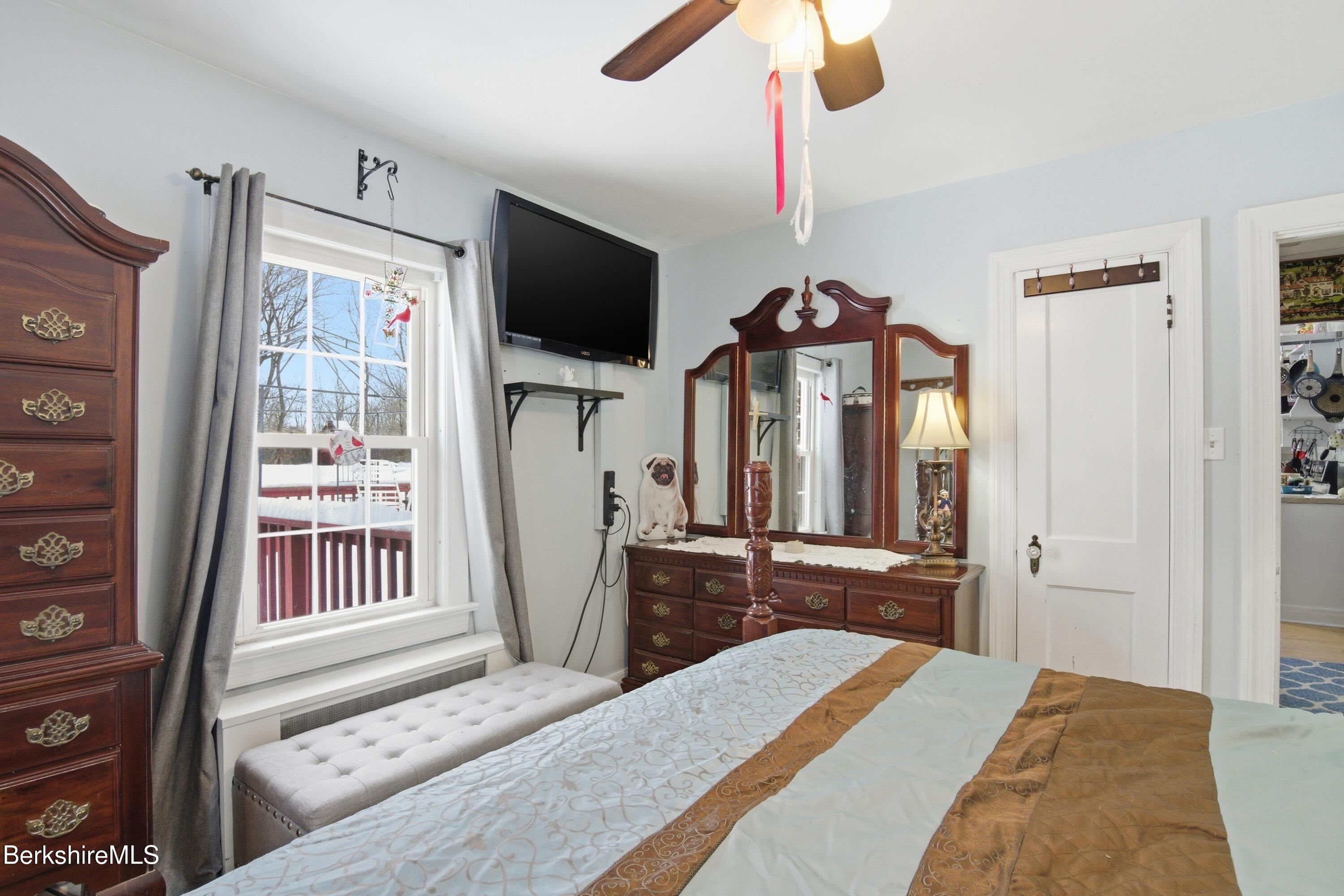 53 Edison Avenue Pittsfield, MA 01201 - Photo 11 of 45 a bedroom with a bed and a flat screen tv