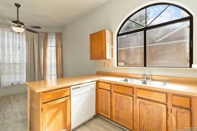 a kitchen with a sink and a window
