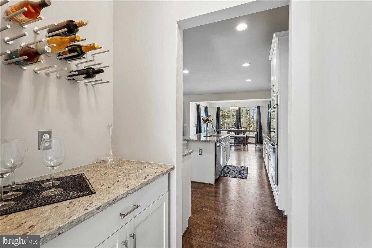12268 Sedge Street Bristow, VA 20136 - Photo 10 of 48 a hallway with a view of living room