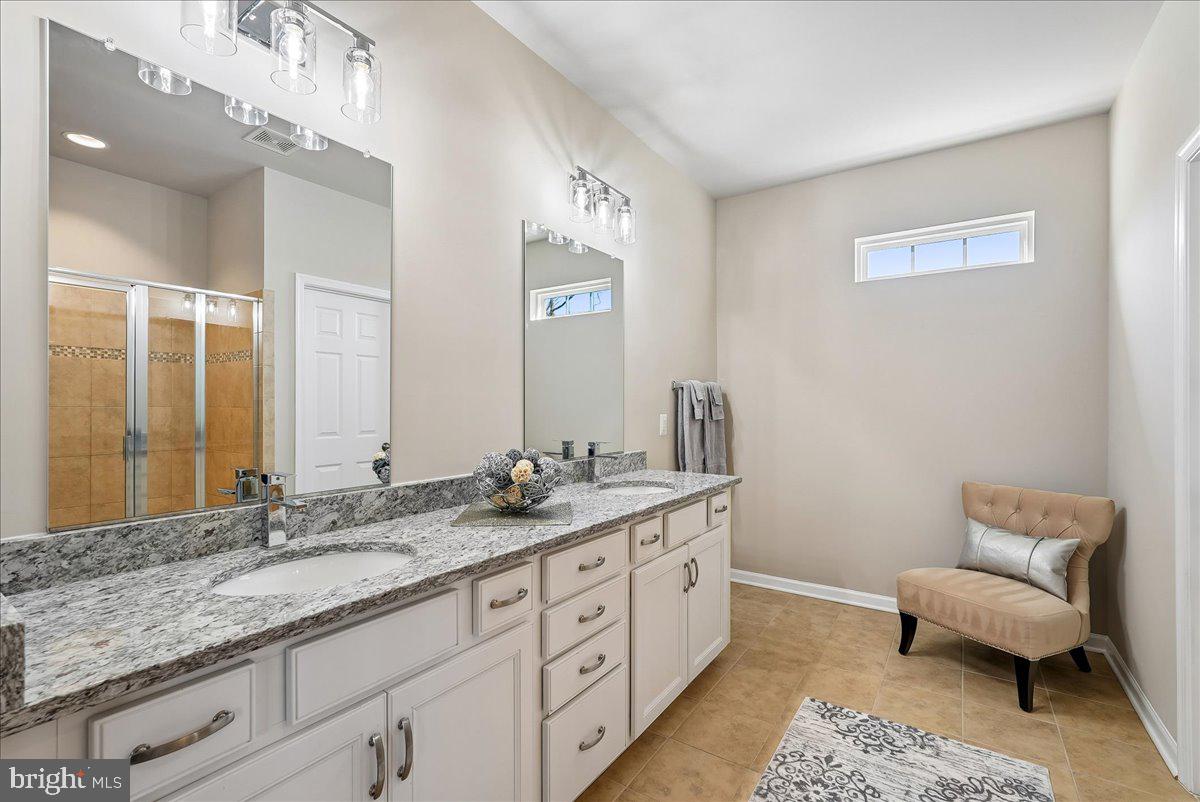 12268 Sedge Street Bristow, VA 20136 - Photo 15 of 48 a bathroom with a granite countertop sink and a mirror