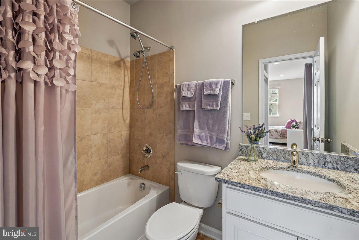 12268 Sedge Street Bristow, VA 20136 - Photo 20 of 48 a bathroom with a granite countertop sink toilet and shower