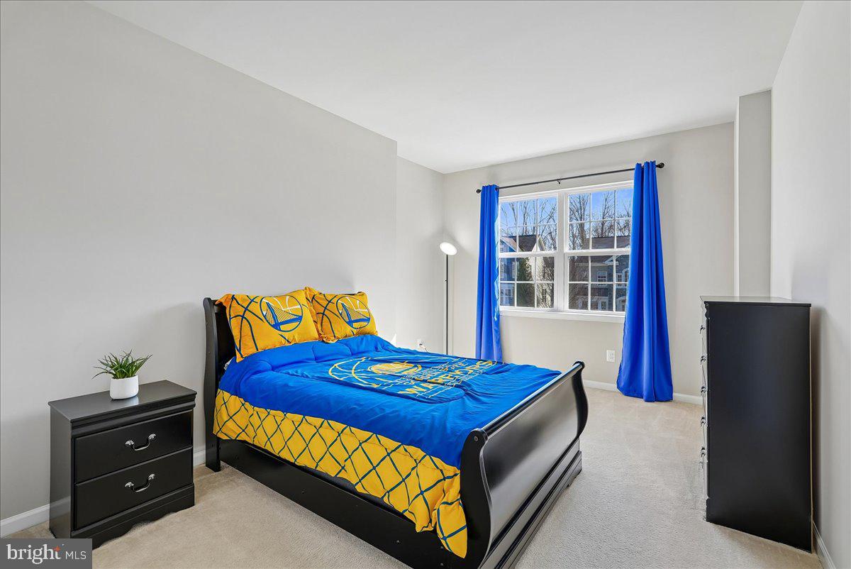 12268 Sedge Street Bristow, VA 20136 - Photo 21 of 48 a bedroom with a bed and windows