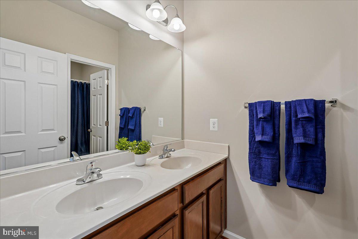 12268 Sedge Street Bristow, VA 20136 - Photo 23 of 48 a bathroom with a sink vanity and a mirror