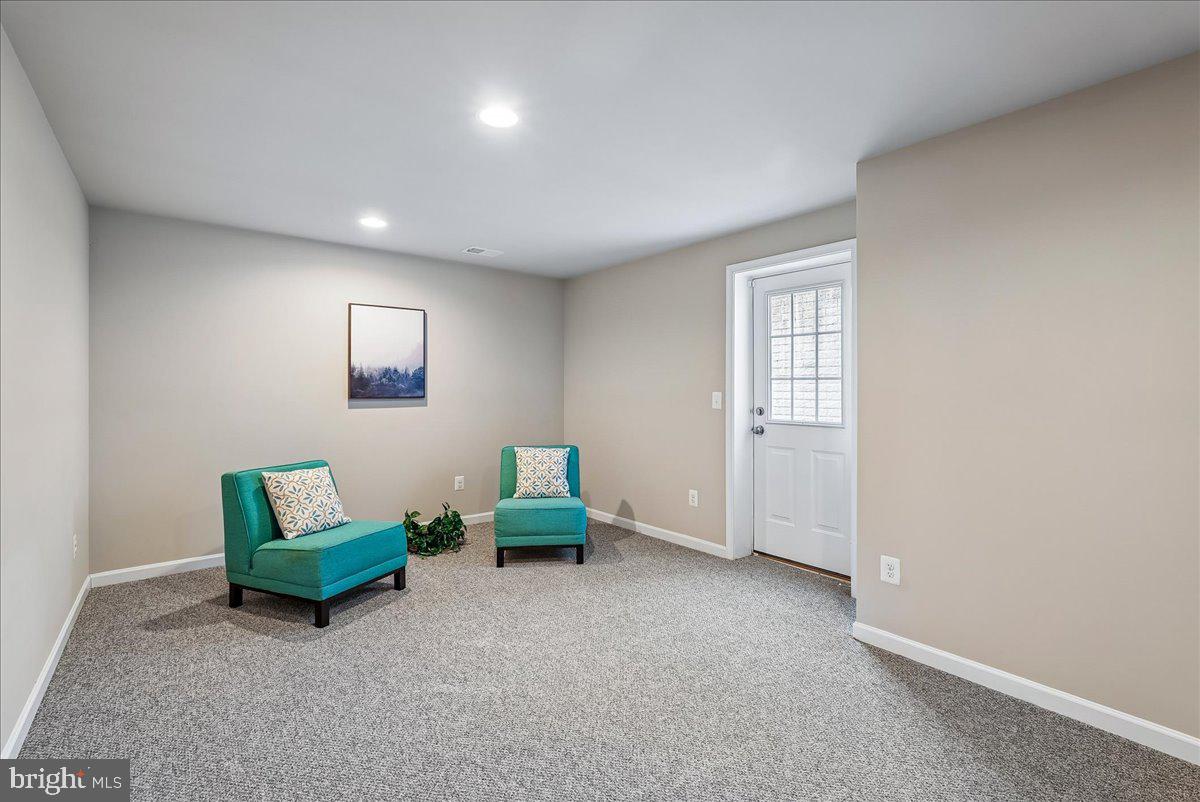 12268 Sedge Street Bristow, VA 20136 - Photo 27 of 48 an empty room with windows and couch