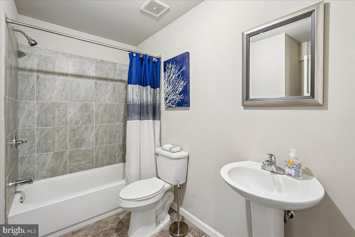 12268 Sedge Street Bristow, VA 20136 - Photo 30 of 48 a bathroom with a sink toilet and shower