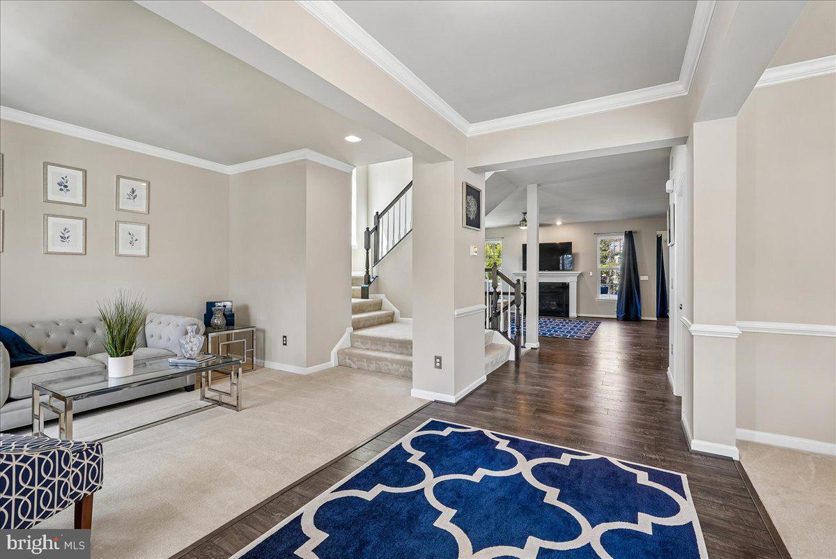 12268 Sedge Street Bristow, VA 20136 - Photo 47 of 48 a living room with furniture and wooden floor