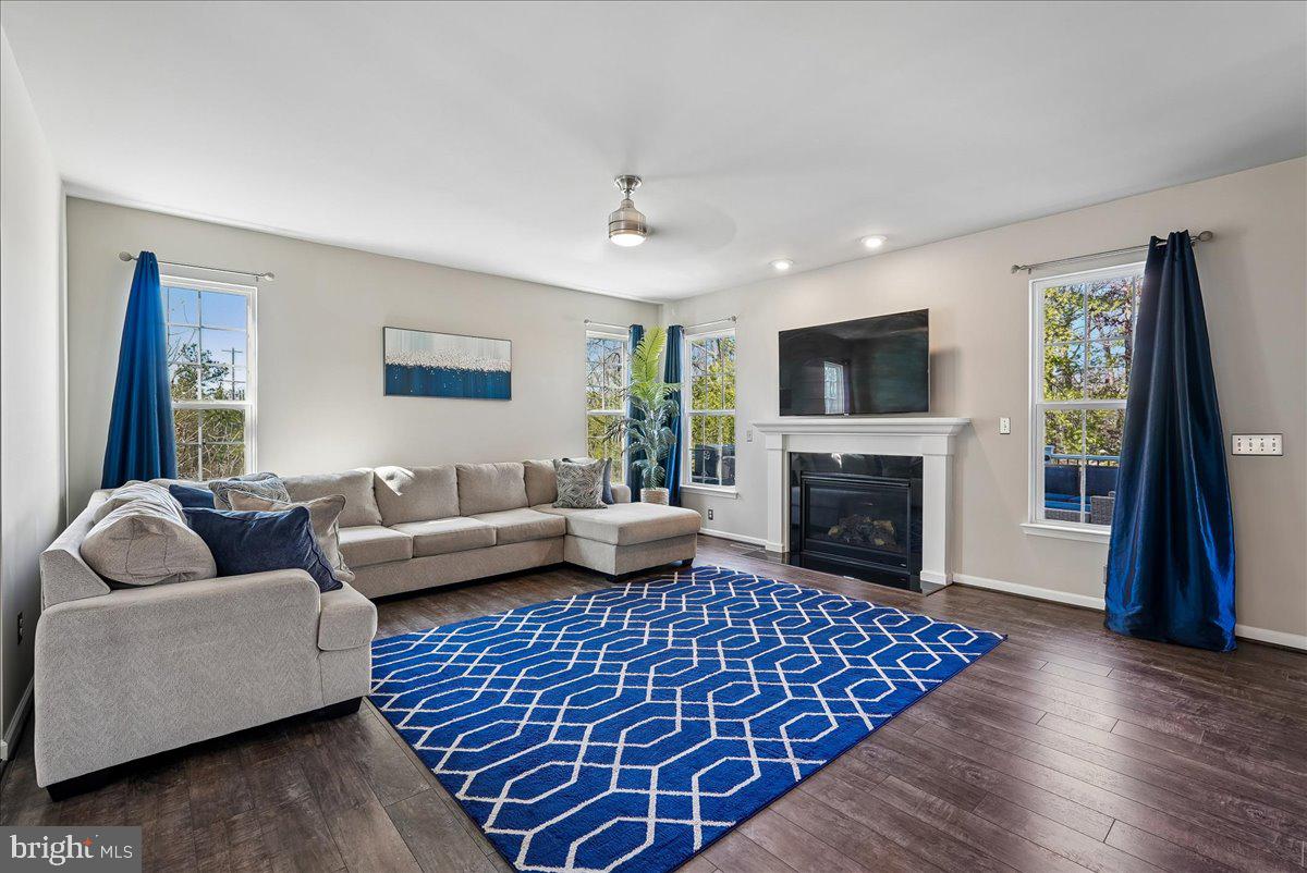 12268 Sedge Street Bristow, VA 20136 - Photo 6 of 48 a living room with furniture and a fireplace