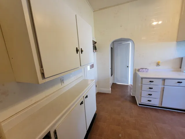 a bathroom with a double vanity sink a mirror and a bathtub