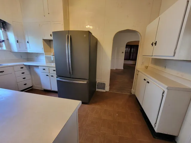 a kitchen with stainless steel appliances a refrigerator and a stove