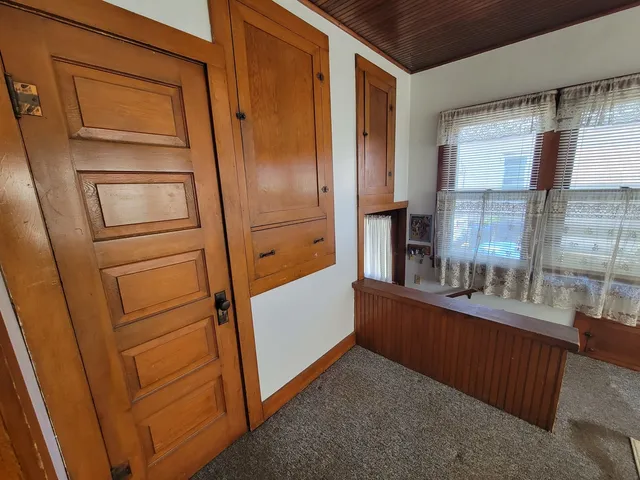 a kitchen with a refrigerator and countertop