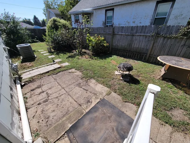 a view of backyard with seating space