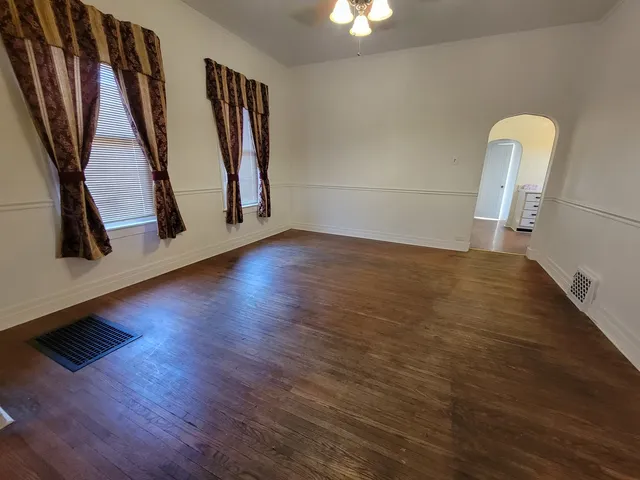 a view of an entryway with wooden floor