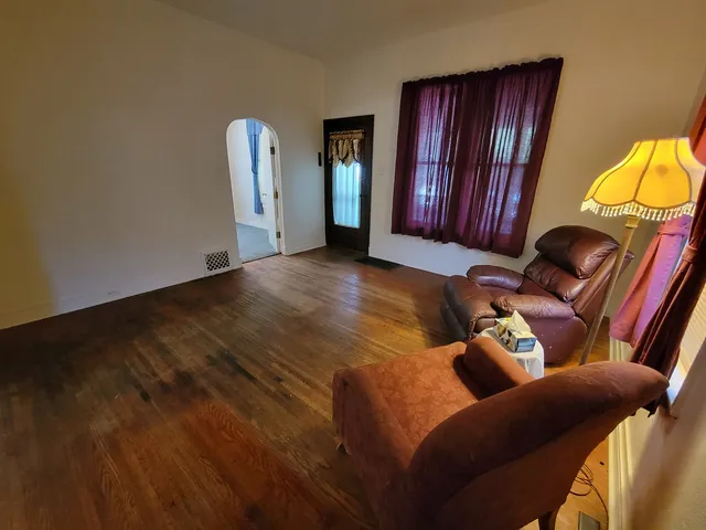 a living room with furniture and a closet