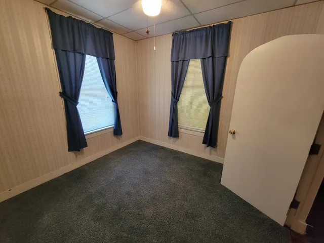 a view of a room with door and stairs