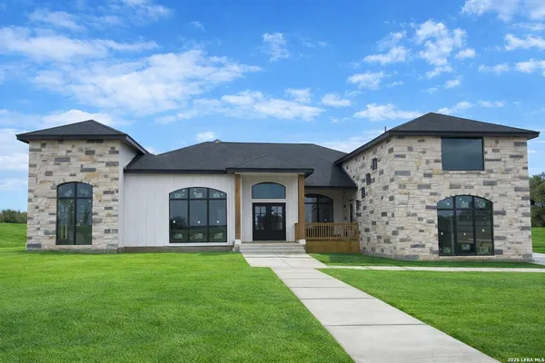 front view of a house with a yard