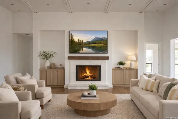 a living room with furniture and a fireplace
