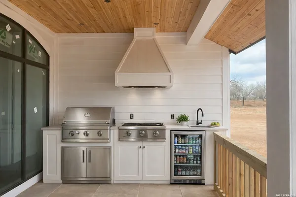 a kitchen with a stove and a refrigerator