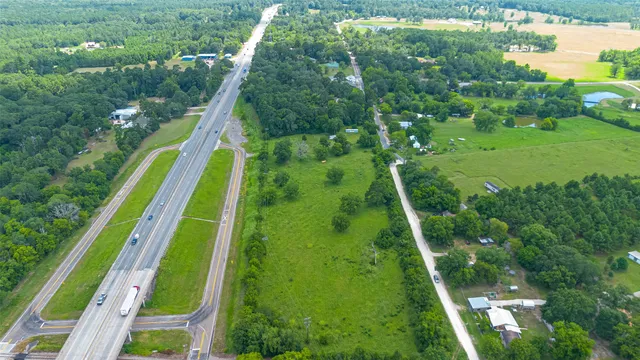 a house with green field in front of it