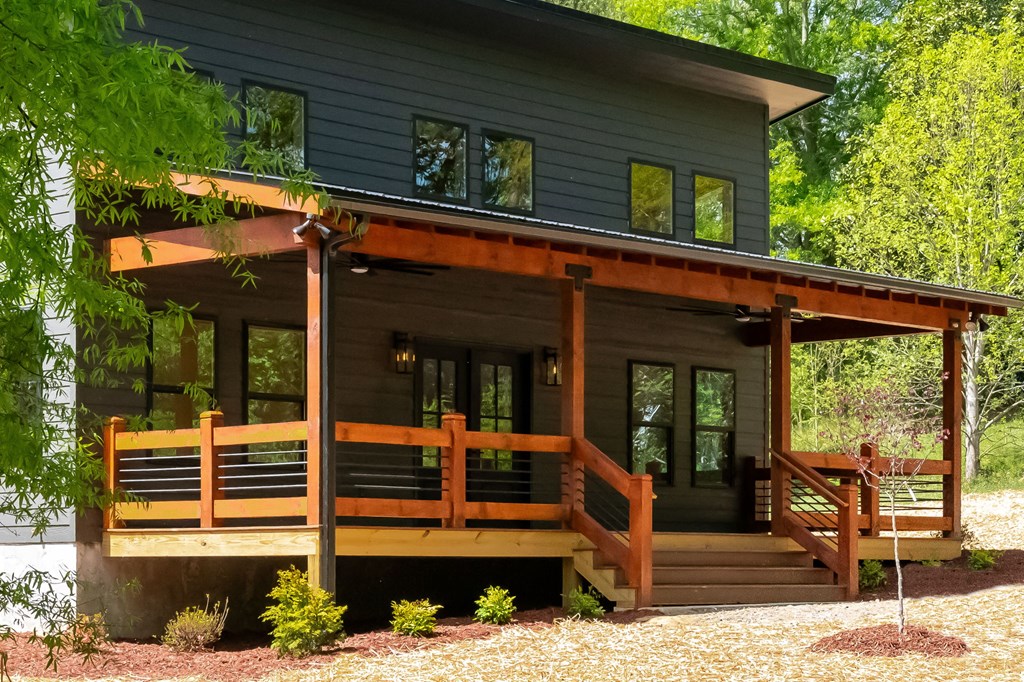 168 Ewing Street Blue Ridge, GA 30513 - Photo 6 of 46 a view of a house with a porch