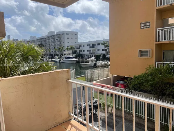 a view of a balcony with lake view and boat