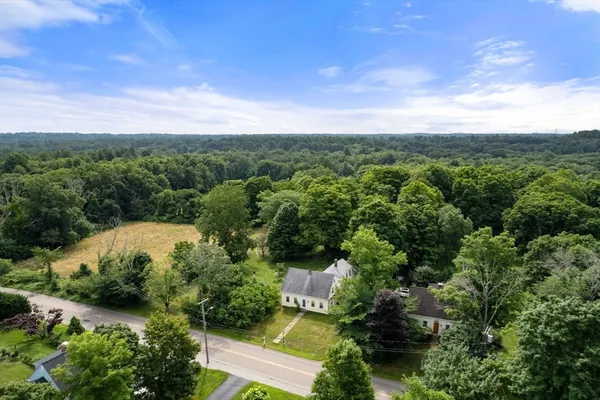 an aerial view of a house with mountain view