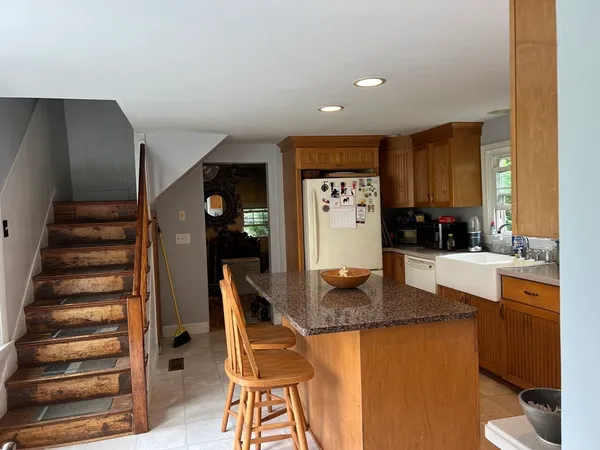 a view of kitchen with cabinets and outdoor space