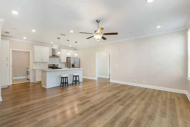 a view of kitchen with microwave and cabinets