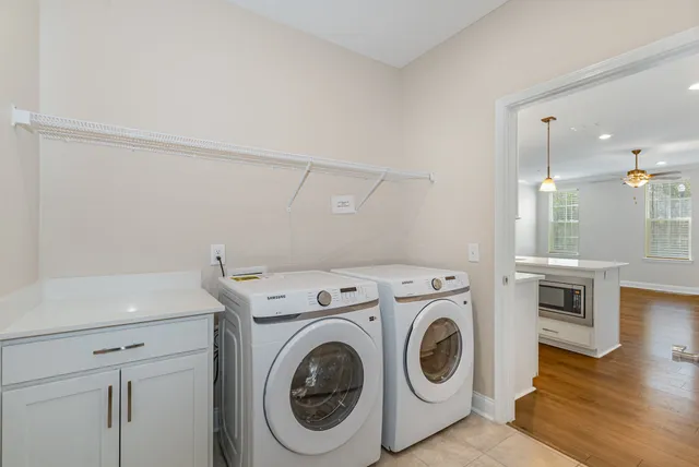 a view of storage and utility room with washer and dryer